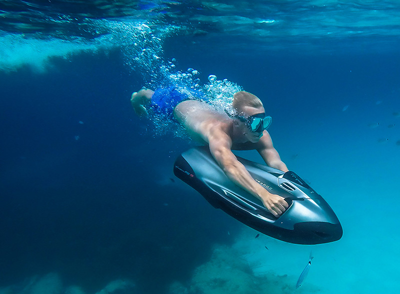 Person using a Seabob underwater